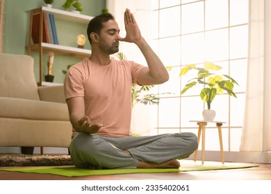 Man meditating in a bright room