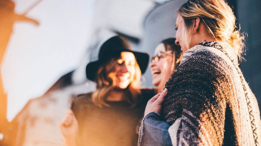 Friends laughing together outdoors